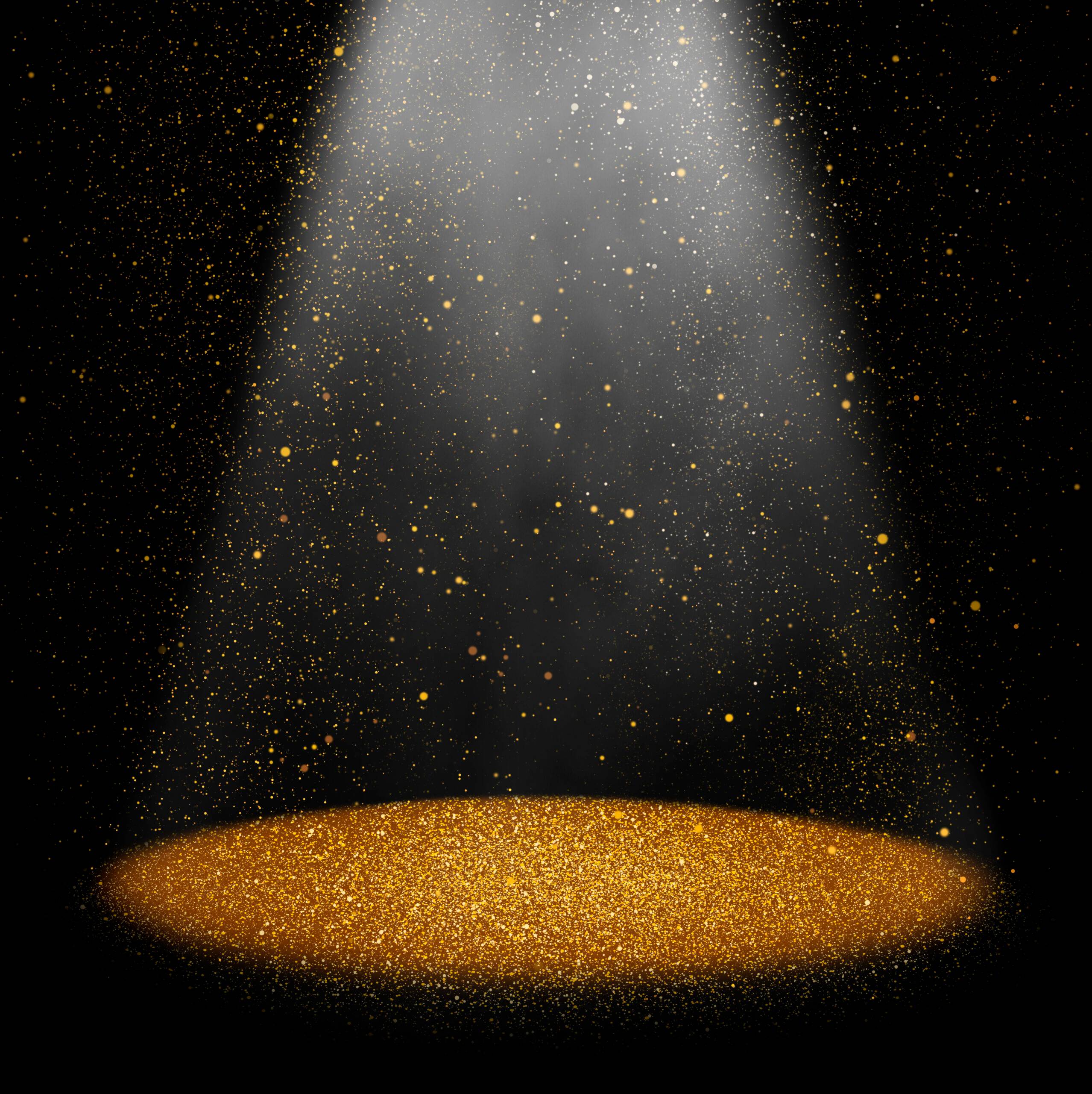 Photo of Twinkling gold glitter falling on the stage illuminated with one spot light