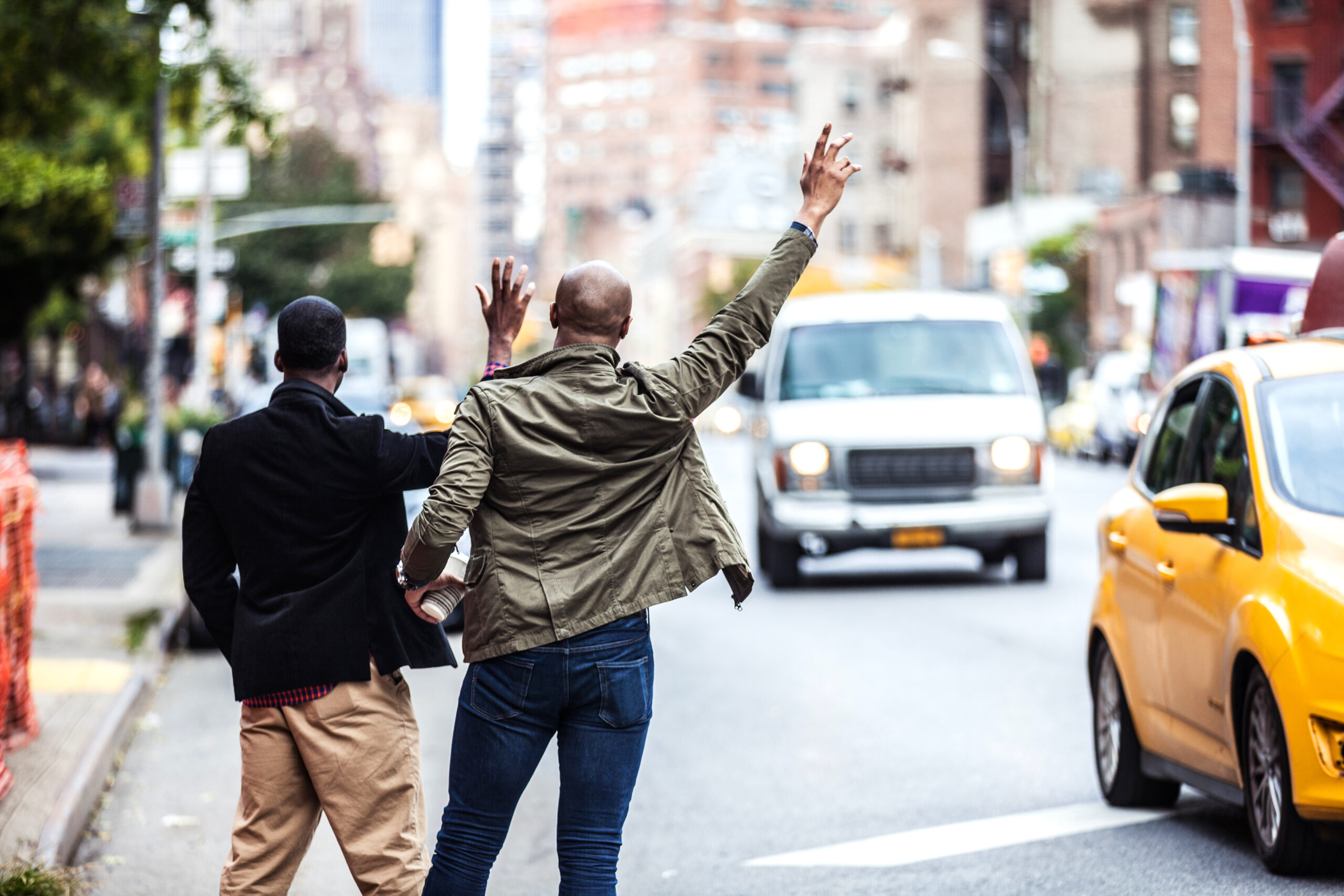 Men hailing a taxi in New York