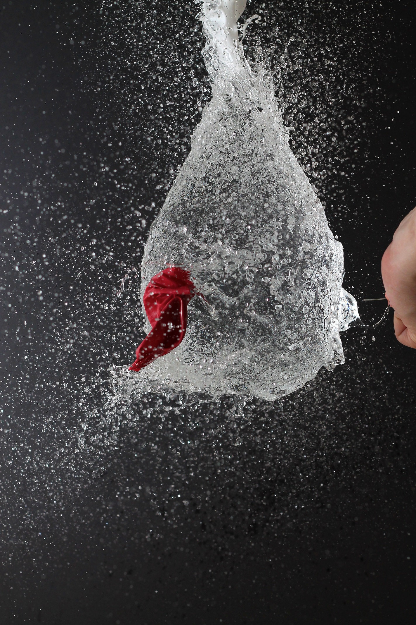Water balloon being punctured in slow motion