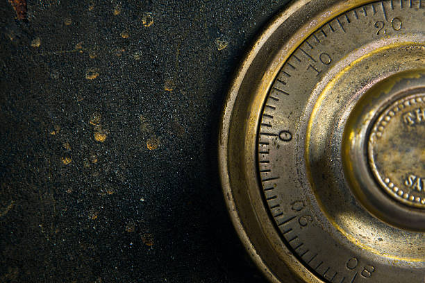 Close-up of a combination dial on an antique safe.