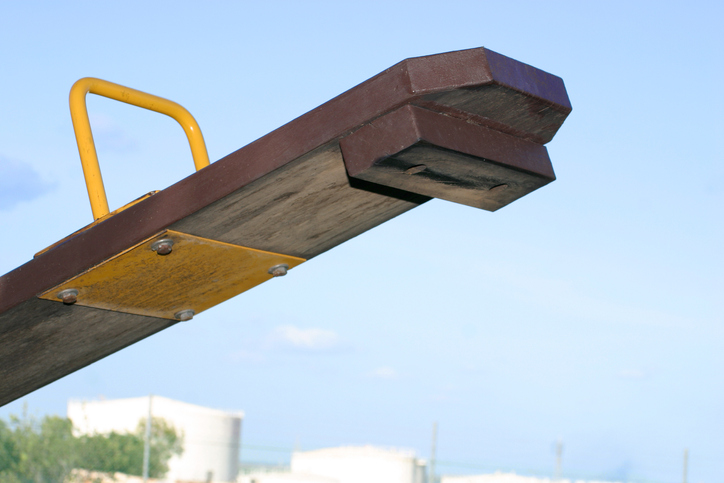 "childrens seesaw, against blue sky background: landscape"