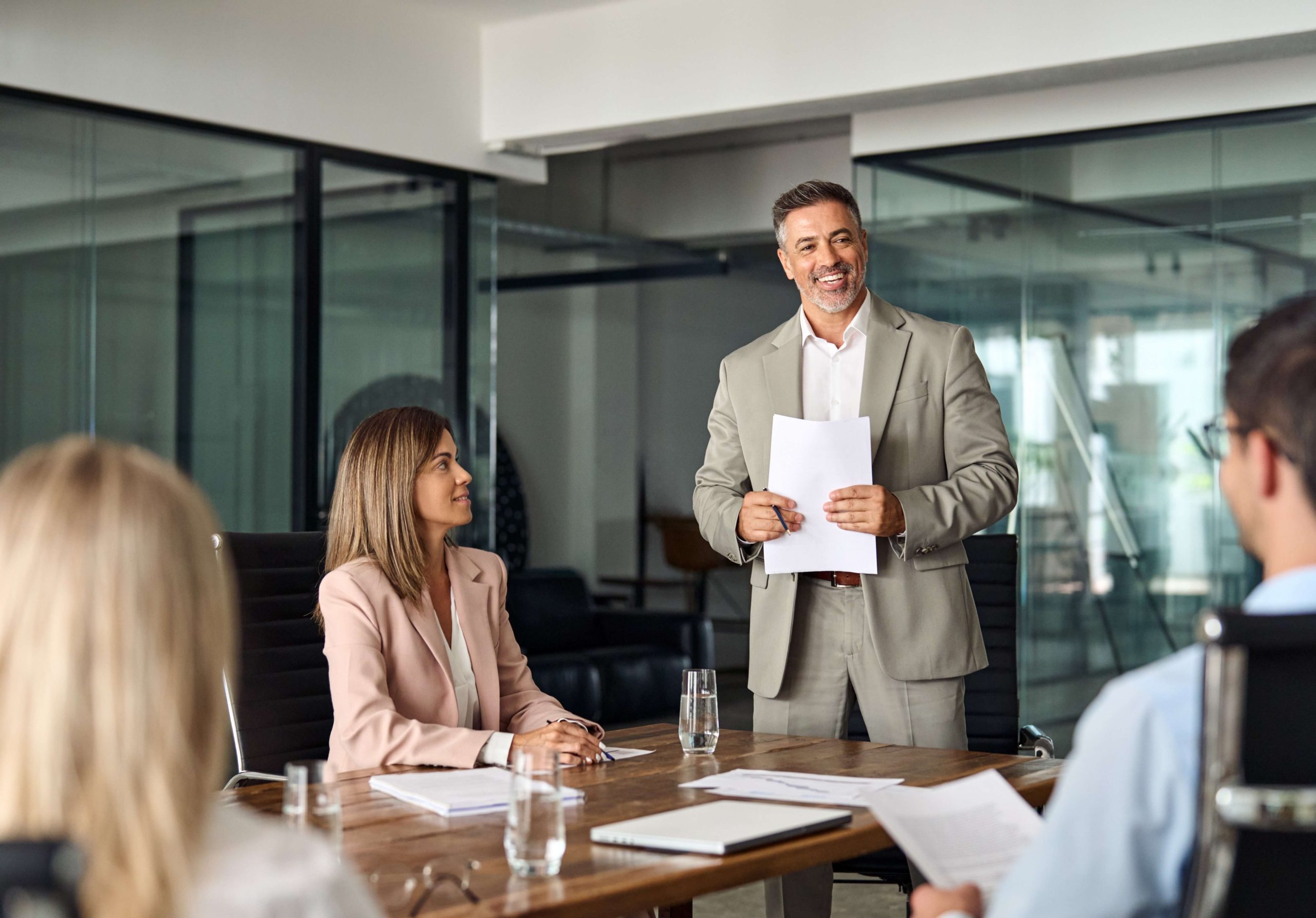 Managing Regulatory Exams - business conference room with smiling people